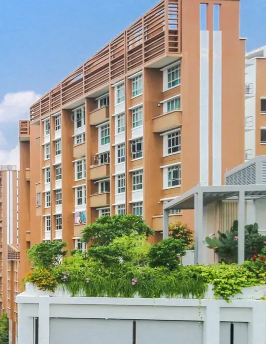 Tall residential block with planting on its lower terraces